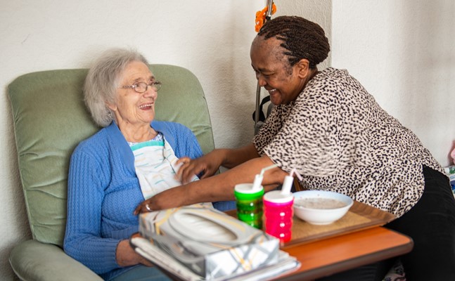 CareGiver helping client with mealtime