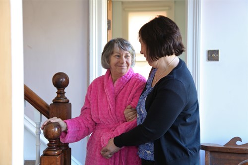 Female carer with female client at home