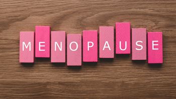 'Menopause' written on pink wooden blocks
