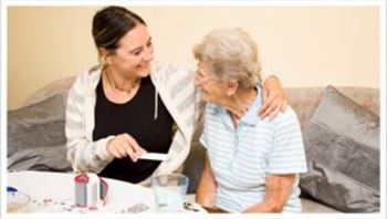 Elderly Lady Smiling with her Care Assistant