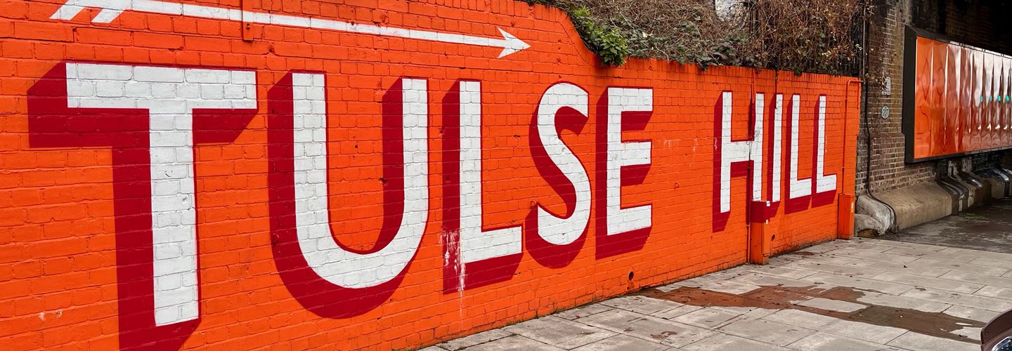 Tulse Hill station wall orange graphic