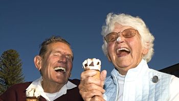 Two Elderly Man Laughing with Ice Creams
